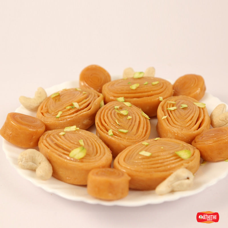 Crispy layered madatha kaja sweet soaked in sugar syrup, a famous Andhra dessert.