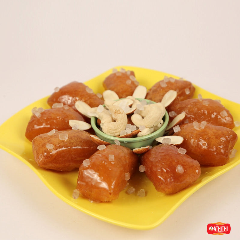 Famous Andhra Kakinada kaja sweet with flaky layers and juicy syrup sweetness.