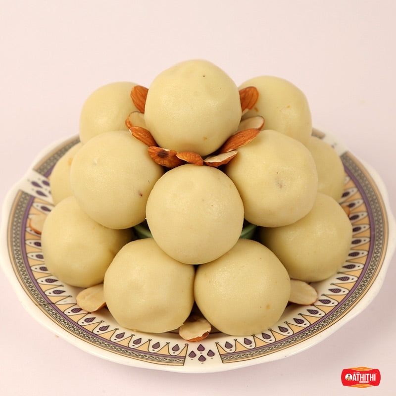 Soft and rich kova laddu sweet made with milk solids in traditional Andhra style.