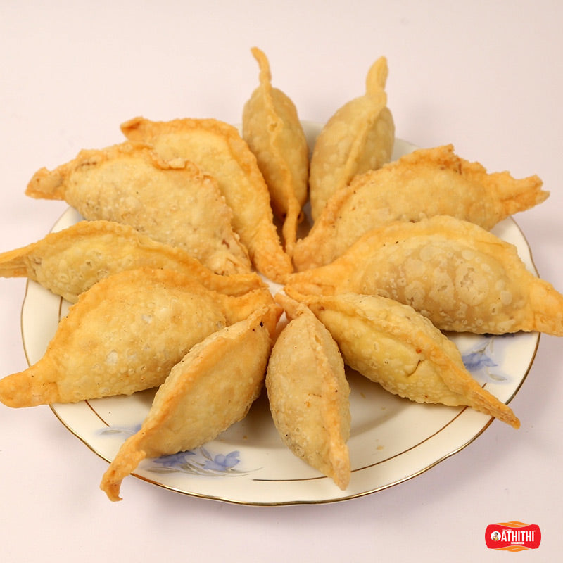 Traditional Andhra sugar kajjikayalu sweet with crispy outer layer and rich sweet filling.