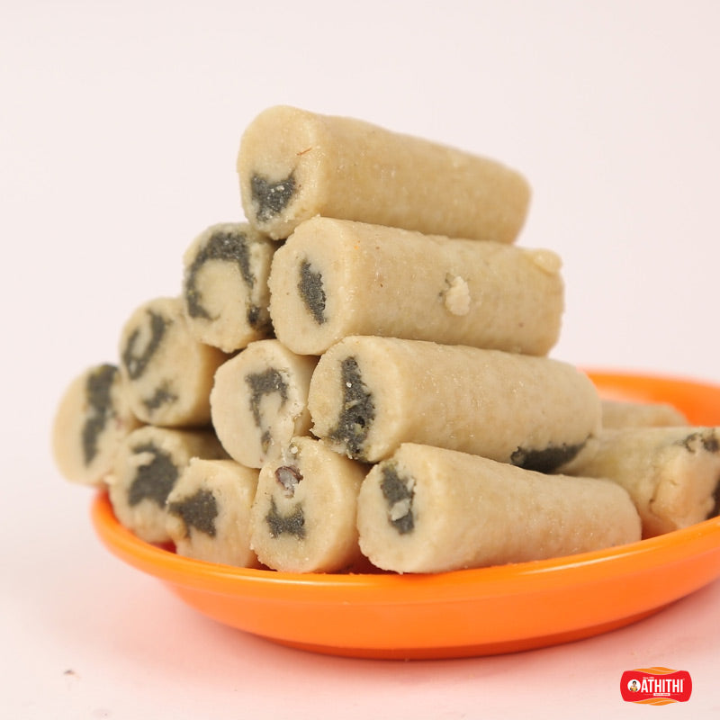 Kaju anjeer rolls made with cashew and fig filling arranged on a plate by Athithi Gruha Foods