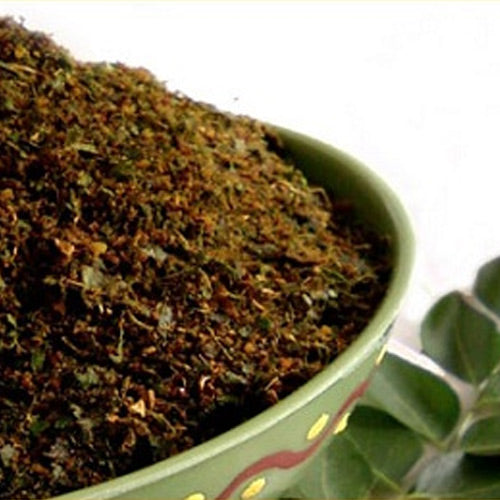 Dark greenish-brown Curry Leaf Karam powder, a healthy traditional South Indian spice blend for rice and idli by Athithi Gruha Foods.