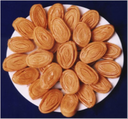 Authentic Andhra style Chitti Kaja (sweet flour shells) with a crispy, layered texture, prepared by Athithi Gruha Foods in Andhra Pradesh.