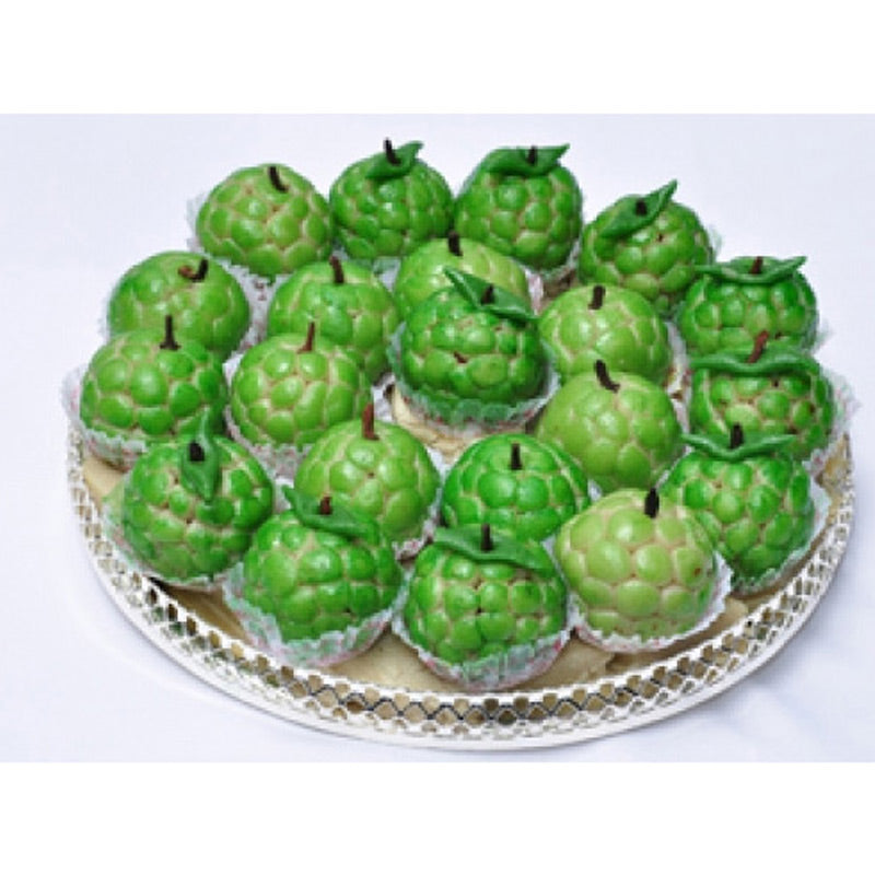Handcrafted green Cashew Seetafal (Kaju Sitaphal) sweets shaped like custard apples, prepared by Athithi Gruha Foods.