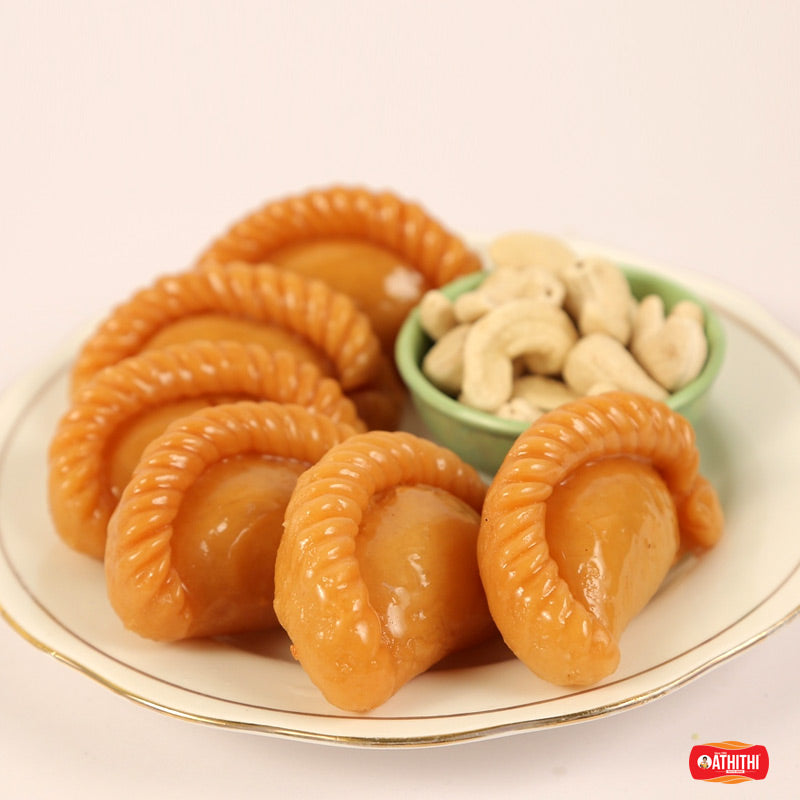 Andhra style Chandra Kalalu (Kajji Kayalu) with a sweet nut filling, prepared by Athithi Gruha Foods in Andhra Pradesh.