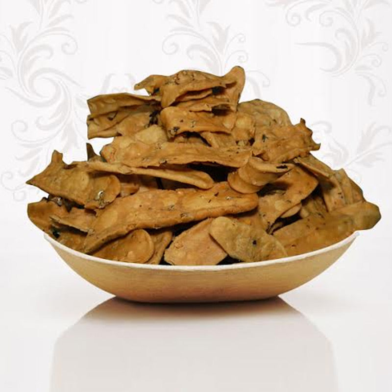Crunchy and thin Andhra style Chekka Pakoda strips, a traditional savory snack handcrafted by Athithi Gruha Foods.