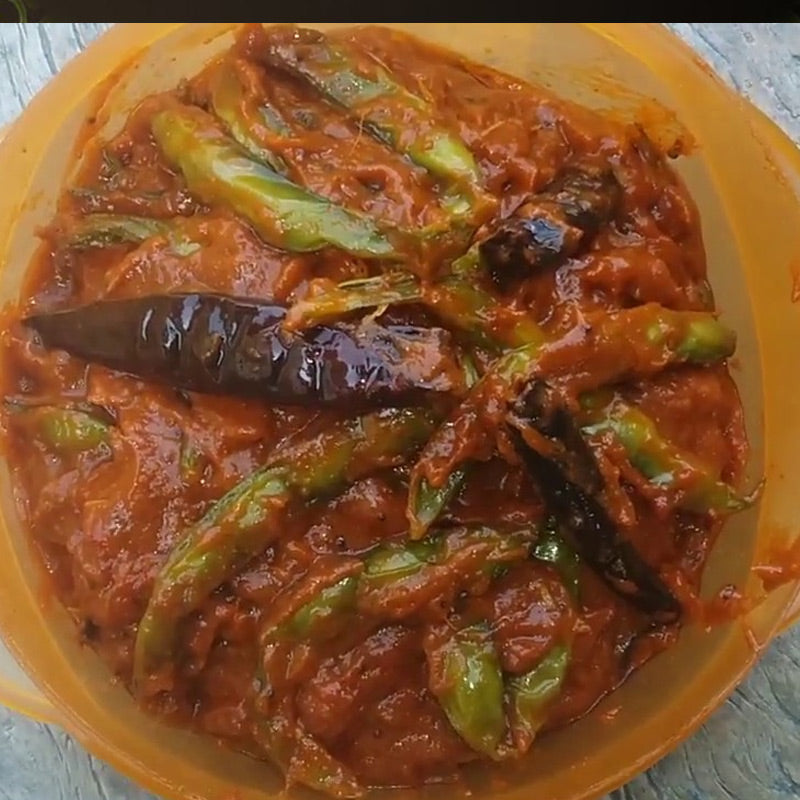 Freshly made traditional Andhra Chikkudukaya Pickle with a thick spicy gravy, a premium savory specialty from Athithi Gruha Foods.