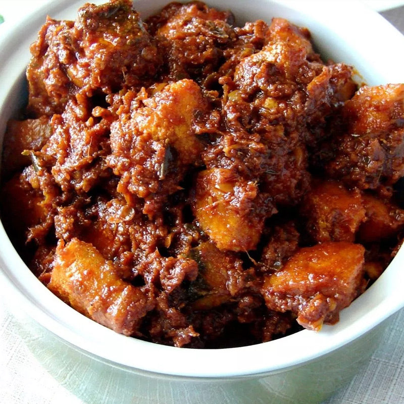 Andhra fish pickle spicy seafood avakaya made with fresh fish and traditional spices
