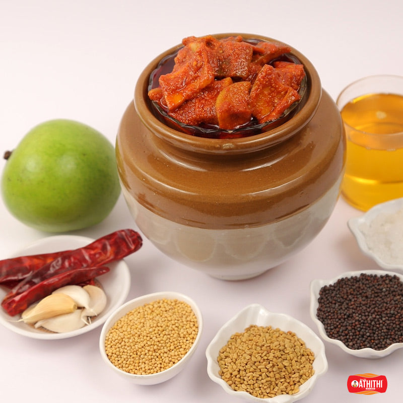 Classic Andhra mango pickle prepared with raw mango pieces and bold traditional spices.
