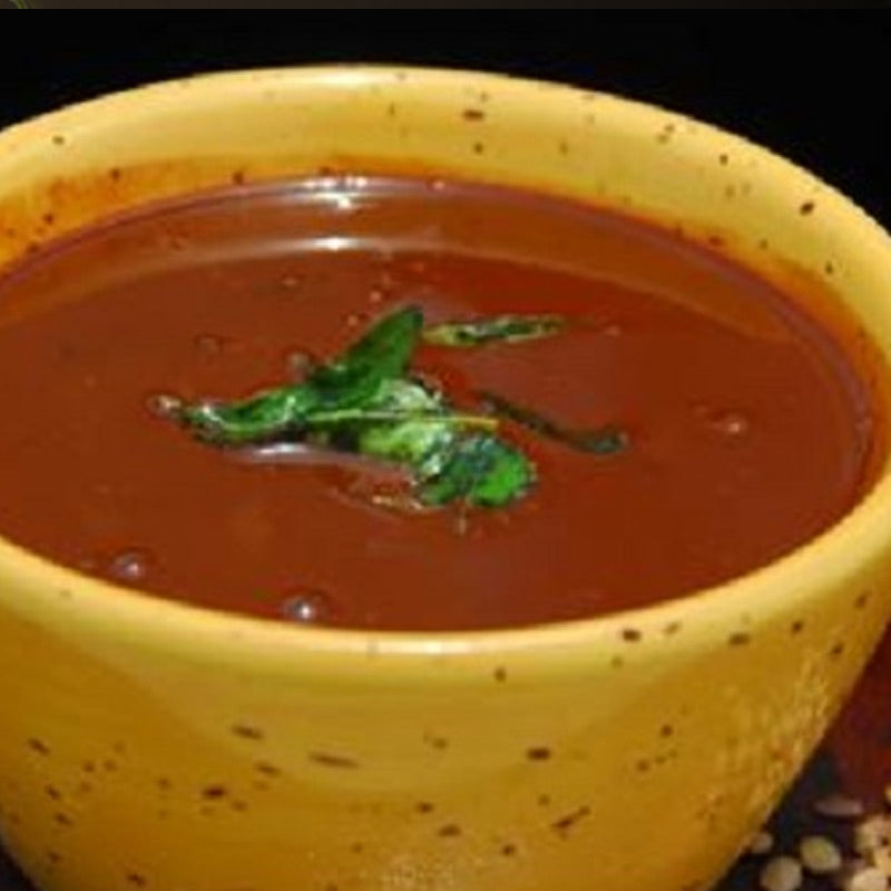 Traditional Andhra ulavacharu made from horse gram served as a rich and flavorful soup with rice
