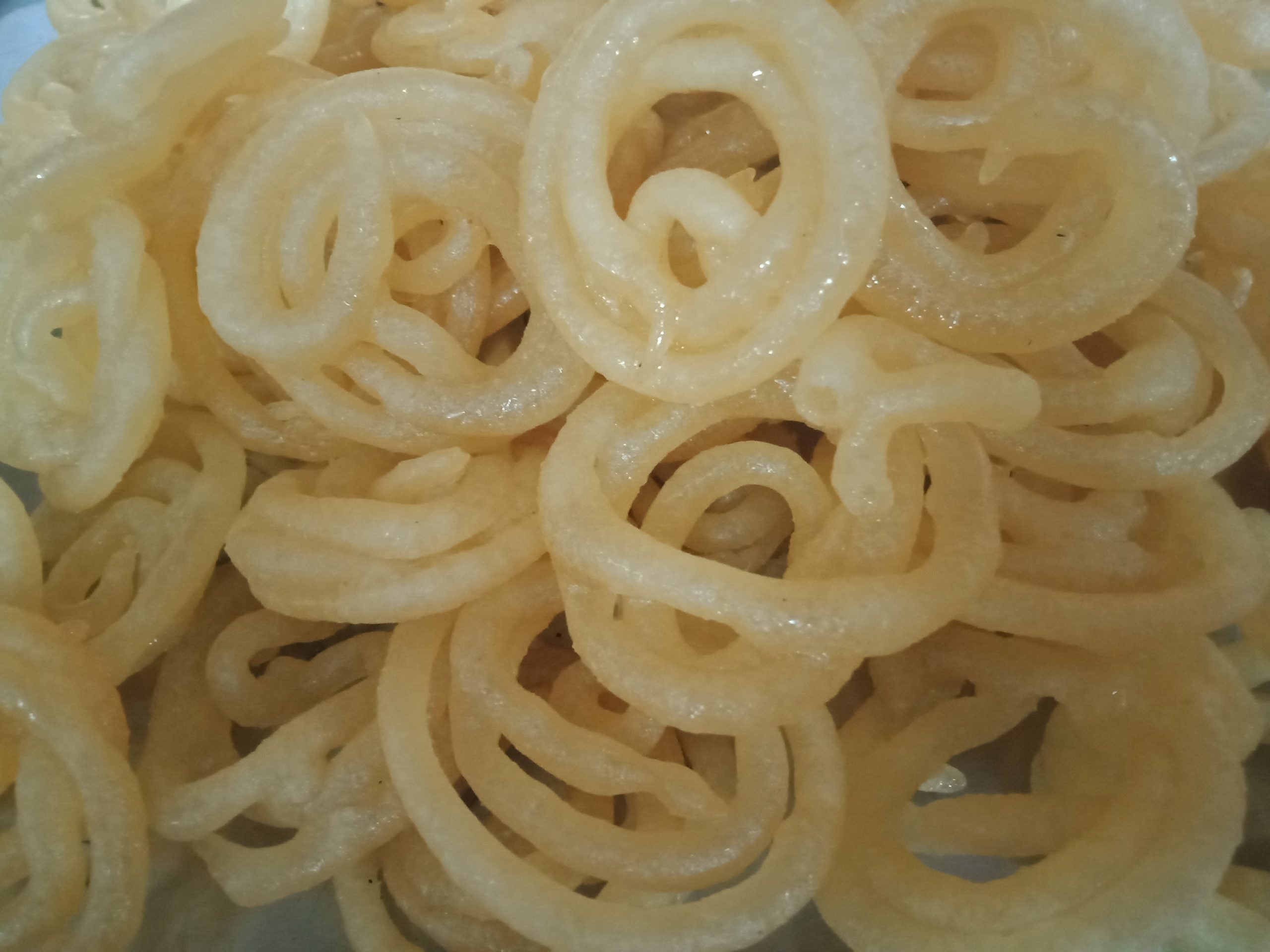 Traditional ghee jangri sweet soaked in sugar syrup, a popular Andhra festive dessert.
