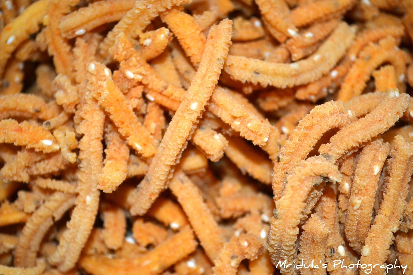 Crunchy Madras murukulu sticks prepared with rice flour and spices as a traditional South Indian snack.